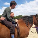 therapeutisches-reiten-Pferde- Therapie Henry Sandkuhle